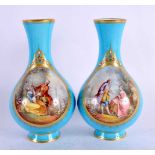 A PAIR OF 19TH CENTURY FRENCH SEVRES PORCELAIN VASES painted with lovers within landscapes. 16 cm