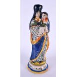 AN ANTIQUE FRENCH FAIENCE FIGURE OF ST MARIE. 23 cm high.