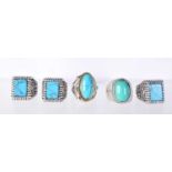 FIVE WHITE METAL FASHION RINGS SET WITH LARGE TURQUOISE COLOURED CABOCHONS. Sizes T -W, total weight