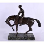 A LOVELY EARLY 20TH CENTURY EUROPEAN BRONZE FIGURE OF A HORSE AND JOCKEY modelled with head down