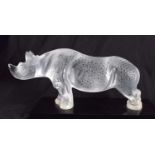A LALIQUE FRENCH GLASS RHINOCEROS TOBA FIGURE modelled upon a black glass base. 28 cm x 14 cm.