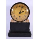 AN EARLY VICTORIAN BLACK SLATE AND MARBLE MANTEL CLOCK with engine turned gilt dial, supported