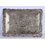 A LARGE 19TH CENTURY JAPANESE MEIJI PERIOD WHITE METAL REPOUSSE DISH decorated in relief with