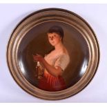 AN EARLY 20TH CENTURY VIENNA PORCELAIN DISH C1910 painted with a young female holding a candle. 30