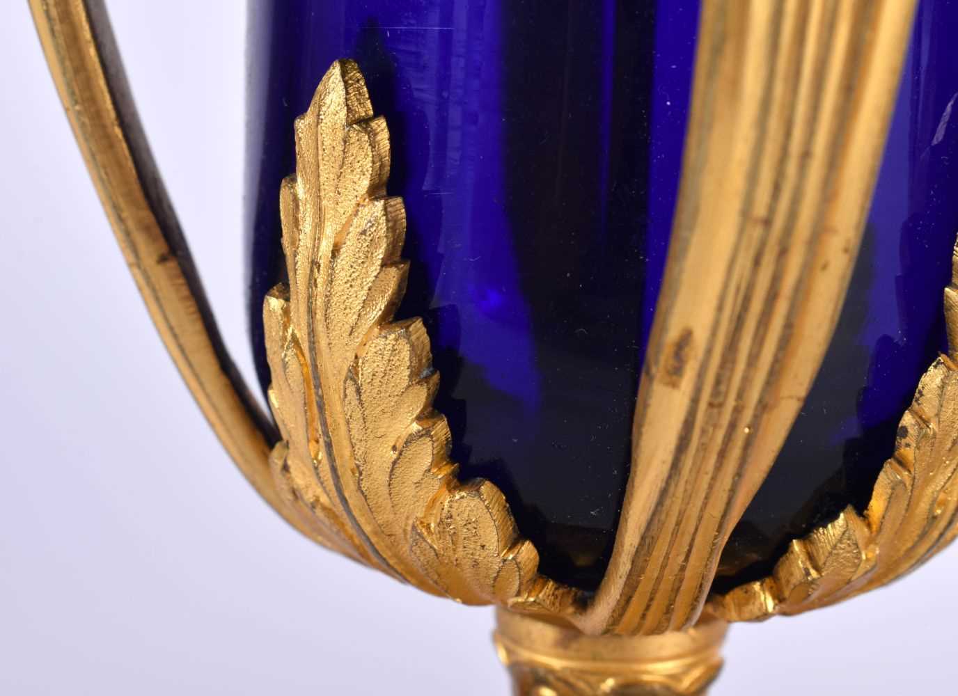 A LOVELY PAIR OF EARLY 19TH CENTURY FRENCH BLUE GLASS EMPIRE ORMOLU VASES modelled upon acanthus - Image 3 of 7