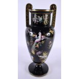 A LARGE AESTHETIC MOVEMENT TWIN HANDLED BLACK JACKFIELD TYPE VASE enamelled with birds and