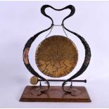 A STYLISH ART NOUVEAU WROUGHT IRON AND COPPER DINNER GONG of organic scrolling form. 40 cm x 28 cm.