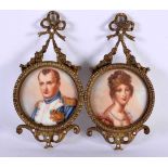 A PAIR OF EARLY 20TH CENTURY FRENCH BRONZE AND PORCELAIN HANGING PLAQUES depicting Napoleon &