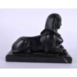 A 19TH CENTURY GRAND TOUR BLACK PAINTED METAL AND MARBLE MODEL OF A SPHINX After the Antiquity. 18