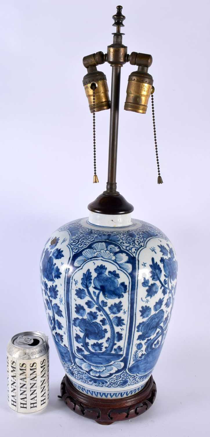 A LARGE 18TH CENTURY DUTCH DELFT TIN GLAZED COUNTRY HOUSE LAMP painted with flowers. 57 cm high.