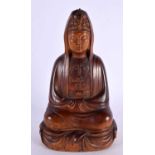 A 19TH CENTURY CHINESE CARVED HARDWOOD FIGURE OF A SEATED BUDDHA modelled wearing flowing robes upon