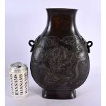 A LARGE 19TH CENTURY JAPANESE MEIJI PERIOD TWIN HANDLED BRONZE VASE decorated in relief with a