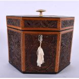 A LATE 18TH/19TH CENTURY MAHOGANY SCROLL WORK TEA CADDY decorated all over with foliage and