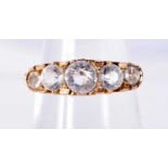 A 9CT GOLD RING SET WITH 5 GRADUATED WHITE SAPPHIRES. Size N, Stamped 9K, weight 2.5g