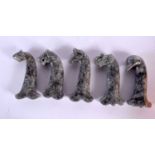 FIVE MIDDLE EASTERN CARVED GREY AGATE HARDSTONE DAGGER HANDLES in various forms. 15 cm long. (5)