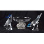 A PAIR OF FRENCH LALIQUE BLUE AND CLEAR GLASS BIRDS together with a Lalique bird bowl. Largest 14 cm