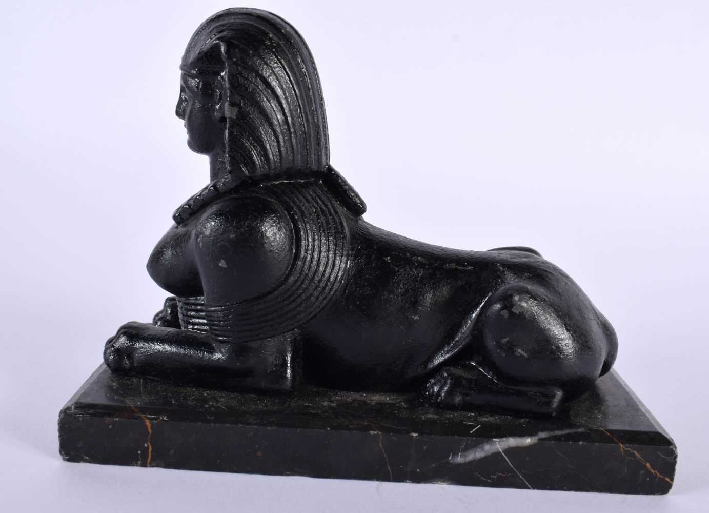 A 19TH CENTURY GRAND TOUR BLACK PAINTED METAL AND MARBLE MODEL OF A SPHINX After the Antiquity. 18 - Image 3 of 5