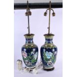 A LARGE PAIR OF CHINESE REPUBLICAN PERIOD CLOISONNE ENAMEL LAMPS decorated with foliage. 80 cm x