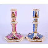 A RARE PAIR OF 19TH CENTURY GERMAN KPM BERLIN PORCELAIN CANDLESTICKS painted in the Meissen style.