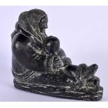 AN INUIT NORTH AMERICAN SCULPTURE OF A MOTHER AND CHILD. 16 cm x 14 cm.