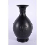 AN ANTIQUE WEDGWOOD BLACK BASALT PORCELAIN VASE decorated in relief with figures. 12 cm high.