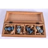A BOXED SET OF FOUR 19TH CENTURY ITALIAN GRAND TOUR GLASS VASES After the Antiquity. 3.5 cm high. (