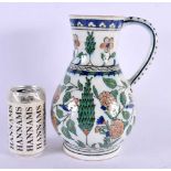 A LARGE TURKISH OTTOMAN MIDDLE EASTERN IZNIK TYPE JUG painted with flowers. 26 cm x 12 cm.