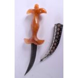 A MIDDLE EASTERN CARVED ORANGE AGATE AND NIELLO DAGGER. 27 cm long.