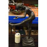 A LARGE ART DECO BRONZED TERRACOTTA FIGURE OF A DANCER modelled upon a naturalistic base. 55 cm