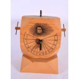 A CARVED WOOD SUNDIAL. 25 cm x 12 cm.