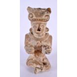 A SOUTH AMERICAN POTTERY TRIBAL FIGURE. 21 cm high.