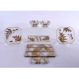 A LOVELY SET OF ART DECO FRENCH CRYSTAL AND GILT GLASS TABLE SETTINGS including coasters, knife