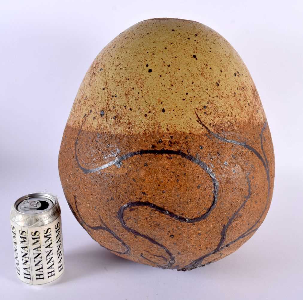 AN UNUSUAL LARGE ENGLISH STUDIO POTTERY STONEWARE DINOSAUR EGG painted with motifs. 35 cm x 28 cm.