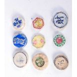 A collection of early Southeast Asian gambling Tokens largest 1.5 cm (9).