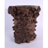 AN UNUSUAL 18TH CENTURY CHINESE CARVED ROOTWOOD BRUSH POT Qing, of naturalistic form, formed as a