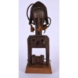 AN AFRICAN TRIBAL CARVED WOOD PULLEY. 24 cm high.