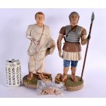 A PAIR OF EARLY 20TH CENTURY CARVED PLASTER OF PARIS FIGURES OF ROMAN SOLDIERS modelled upon