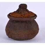 AN UNUSUAL ASIAN POTTERY CENSER AND COVER inset with a buddhistic icon. 12 cm x 9 cm.