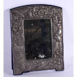 A LOVELY ENGLISH SILVER REPOUSSE PHOTOGRAPH FRAME decorated with extensive Japanese landscapes.