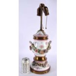 AN ANTIQUE GERMAN TWIN HANDLED PORCELAIN COUNTRY HOUSE LAMP encrusted in flowers. 50 cm high.