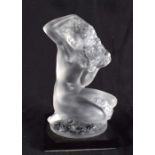 A FRENCH LALIQUE GLASS FIGURE OF A NUDE NYMPH. 9 cm high.