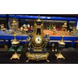 A VINTAGE ITALIAN GILT METAL AND BLUE PORCELAIN CLOCK GARNITURE formed with standing fawns beside