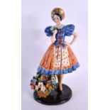 A LARGE 1950S ITALIAN CERAMIC FIGURE OF A STANDING FEMALE in the manner of Lenci. 34 cm x 13 cm.