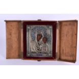 A GOOD 19TH CENTURY CASED RUSSIAN SILVER AND POLYCHROMED WOOD ICON depicting the Madonna and