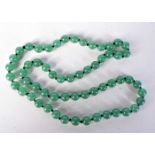 A GREEN JADE BEAD NECKLACE. Length 70cm, Bead size 10mm, weight 88g