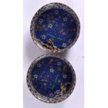 A RARE PAIR OF 18TH/19TH CENTURY CHINESE CLOISONNE ENAMEL CIRCULAR DISHES Qing, decorated with