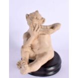 A RARE MARTIN BROTHERS STONEWARE FIGURE OF AN IMP modelled playing an instrument. 14 cm x 9 cm.