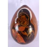 A VINTAGE RUSSIAN LACQUERED MADONNA AND CHILD EGG. 15 cm x 10 cm.