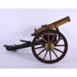 A RARE EARLY 20TH CENTURY MODEL OF A GATLIN GUN bearing 19th century date to body. 32 cm x 22 cm.