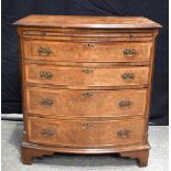 A Walnut Burr inlaid 4 drawer chest with pull out shelf 79 x 71 x 48 cm .